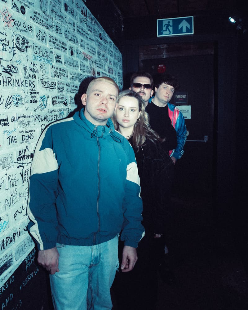 Away Fans portrait — dressing-room group shot, teal duotone